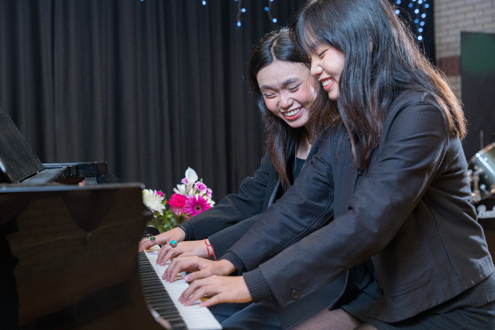 Pupils performing music on stage